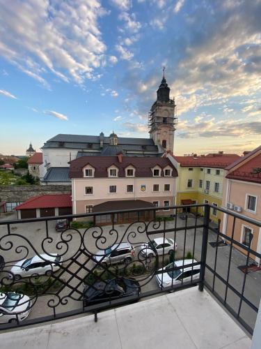 a view of a building with a clock tower at Heart of the old town in Kamianets-Podilskyi