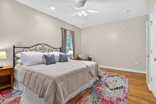a bedroom with a bed and a ceiling fan at Family Screened Porch with Swing Fire Pit Grill and Deck in Luray