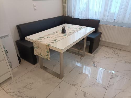 a table and a couch in a living room at Nationalpark Apartment 1 in Apetlon