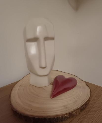 a wooden table with a toilet and a heart on it at Nationalpark Apartment 2 in Apetlon