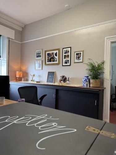 a meeting room with a table with the word hotel on it at Foxes Hotel in Minehead