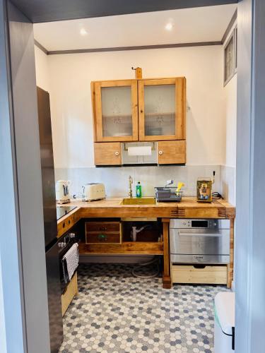 a kitchen with a wooden counter and a sink at Eiszeit in Bitterfeld