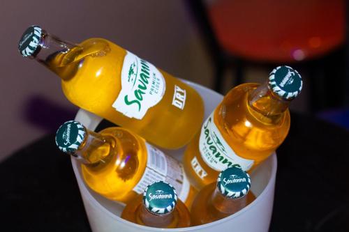a bucket filled with bottles of beer on a table at ebc lodge in Ndola