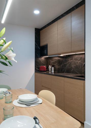 Η κουζίνα ή μικρή κουζίνα στο Apartamentos Lang