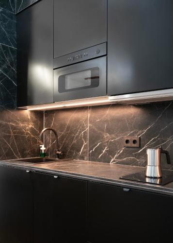 Η κουζίνα ή μικρή κουζίνα στο Apartamentos Lang