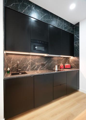 Η κουζίνα ή μικρή κουζίνα στο Apartamentos Lang