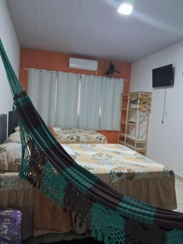 Postel nebo postele na pokoji v ubytování Hospedagem Aconchego Do Lar