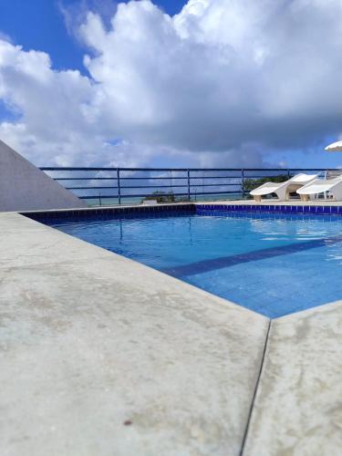 a large swimming pool on top of a building at Flat completo 50m da Praia de Tambaú com vista Mar no Terraço e Piscina in João Pessoa