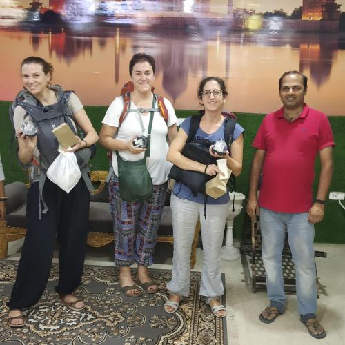 a group of people posing for a picture at The Hideout Agra - Garden Homestay near Taj in Agra