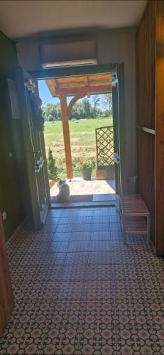 a hallway with a cat laying on a tile floor at Charmdeen in Jastrebarsko