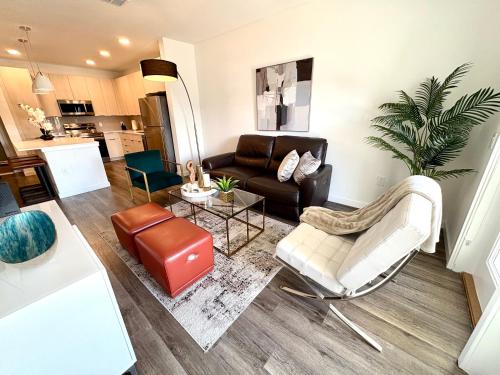 a living room with a couch and a table at Beautiful Apartment close to Attractions in Kissimmee