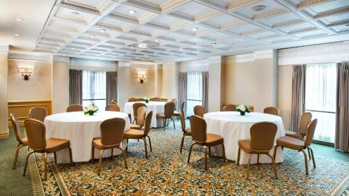 a conference room with tables and chairs and windows at Willard InterContinental Washington by IHG in Washington