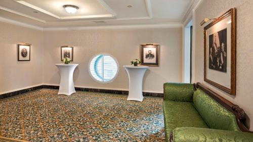 a waiting room with a couch and a window at Willard InterContinental Washington by IHG in Washington