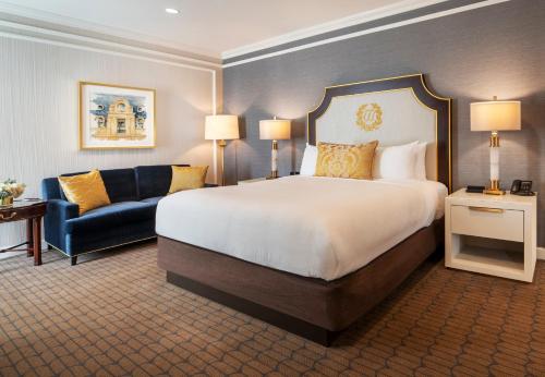 a hotel room with a bed and a couch at Willard InterContinental Washington by IHG in Washington
