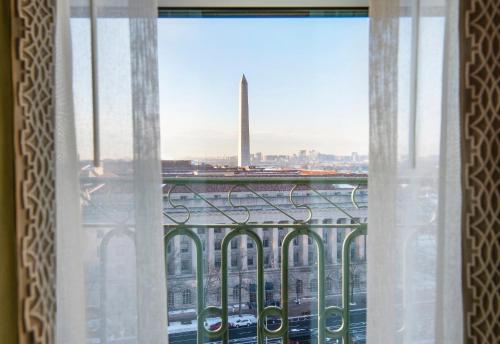 a window with a view of a city at Willard InterContinental Washington by IHG in Washington
