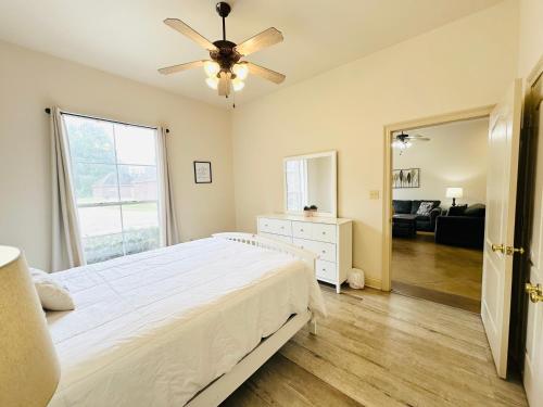 a bedroom with a bed and a ceiling fan at Chateau 7 in Hammond