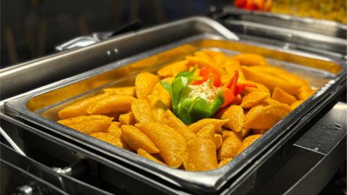 a tray of food with carrots and peppers at Hotel Portobelo Plaza las Ámericas in San Andrés
