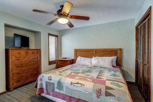 a bedroom with a bed and a ceiling fan at The Highlands at Sugar in Banner Elk