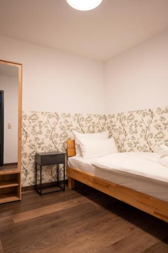 Postel nebo postele na pokoji v ubytování Hotel Sandkorn