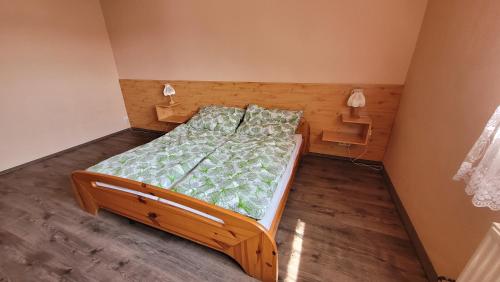 Postel nebo postele na pokoji v ubytování Malom Fogadó