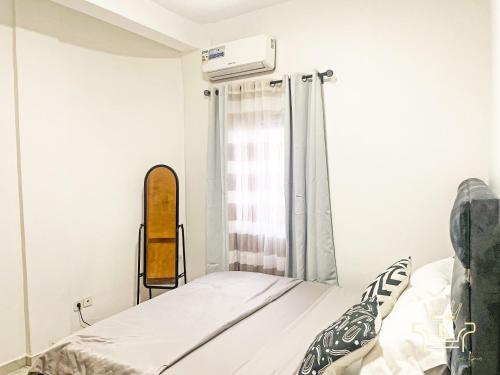 Postel nebo postele na pokoji v ubytování KIM'S Appartments - Nsam