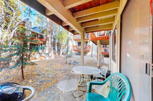 a patio with a table and chairs on a porch at Creekside Retreat in Incline Village
