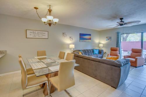 a living room with a table and a couch at Charming Myrtle Beach Townhome Walk to Beach in Myrtle Beach