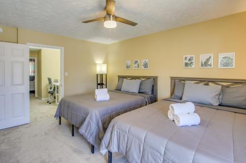 a bedroom with two beds and a ceiling fan at Charming Myrtle Beach Townhome Walk to Beach in Myrtle Beach