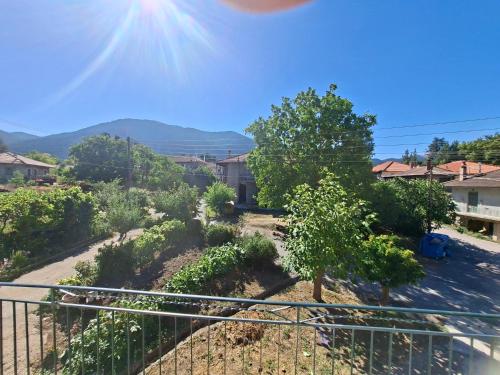 a view from the balcony of a house with a tree at Mainalo View House in Vytina