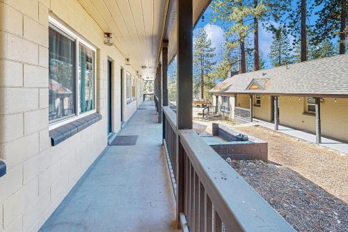 a building with a sidewalk next to a fence at The Chalet at Kings Beach Unit 6 in Kings Beach
