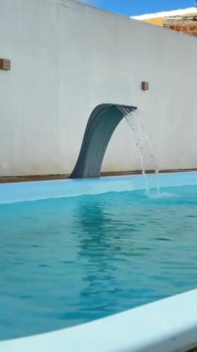 an airplane wing with water shooting out of the window at Espaço Raio de Sol - Piscina e Lazer in Caruaru