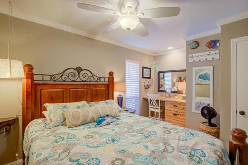 a bedroom with a bed and a ceiling fan at Topsail Dunes 1107 in North Topsail Beach