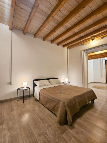 Ένα ή περισσότερα κρεβάτια σε δωμάτιο στο A al Quadrato