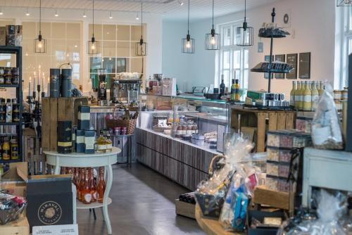 a store with a counter in the middle of a room at Refborg Hotel in Billund