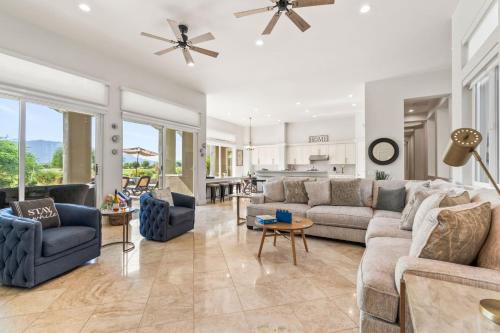 a living room with a couch and chairs and a table at Multi-Million Dollar PGA West 4BR 5BA Pool Spa in La Quinta