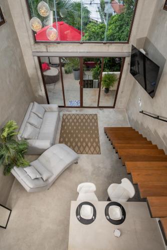 an overhead view of a living room with a large window at Loft de lujo en excelente ubicación in Cancún