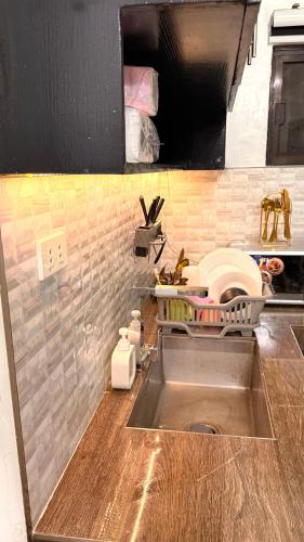a kitchen with a sink and a counter top at Santa Cosy Villa suite-B Fast Wi-Fi, Netflix Included Split system Air-con & Hot Shower Close to Enchanted Kingdom in Santa Rosa