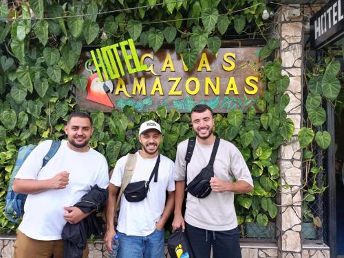 a group of men standing in front of a store at Hotel Gavas Amazonas in Leticia