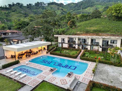 an aerial view of a villa with a swimming pool at Best View Aparta Hotel in Dosquebradas