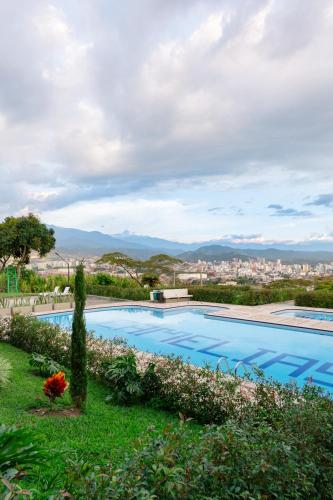 a swimming pool with a view of a city at Best View Aparta Hotel in Dosquebradas