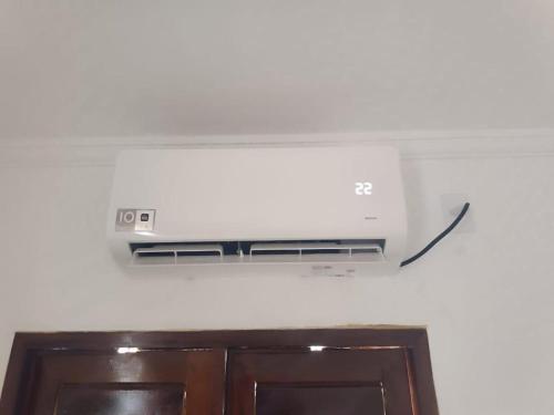 a television hanging from the ceiling in a room at Apartamento Alto de São Manoel in Mossoró