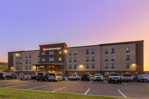 a hotel with cars parked in a parking lot at Best Western Plus Rapid City Rushmore in Rapid City