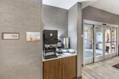a room with a coffee machine on a counter at Best Western Plus Rapid City Rushmore in Rapid City