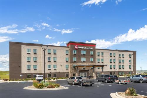 a hotel with cars parked in a parking lot at Best Western Plus Rapid City Rushmore in Rapid City