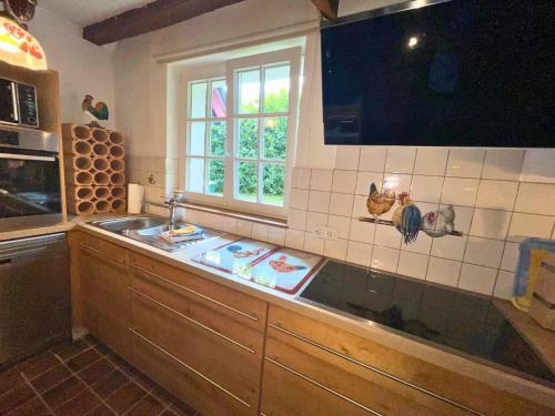 TV a/nebo společenská místnost v ubytování Ferienhaus Emma im Morsbacher Hof