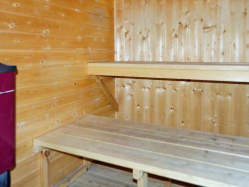 a wooden sauna with a bench in it at 10 person holiday home in Hadsund-By Traum in Hadsund