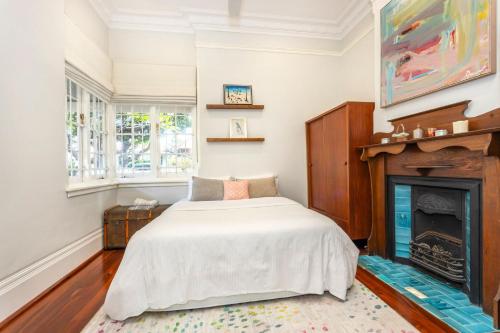 Ένα ή περισσότερα κρεβάτια σε δωμάτιο στο The Federation Cottage