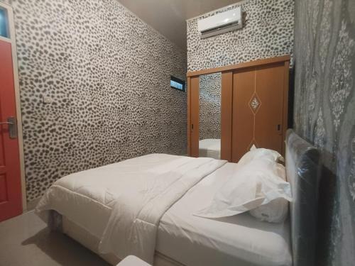 Postel nebo postele na pokoji v ubytování Chandrady Guesthouse