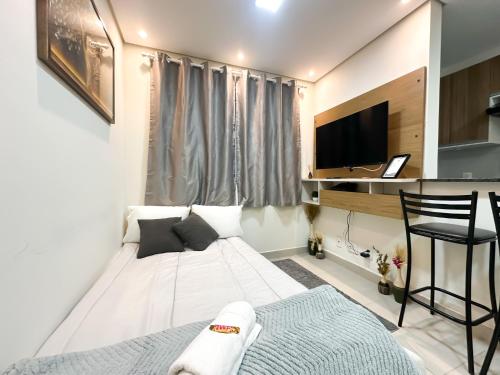 Μια τηλεόραση ή/και κέντρο ψυχαγωγίας στο Apartamento moderno para até 4 pessoas Barra Funda