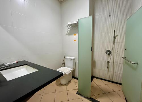 a bathroom with a sink and a toilet at Front One Resort Indraloka Temanggung in Temanggung